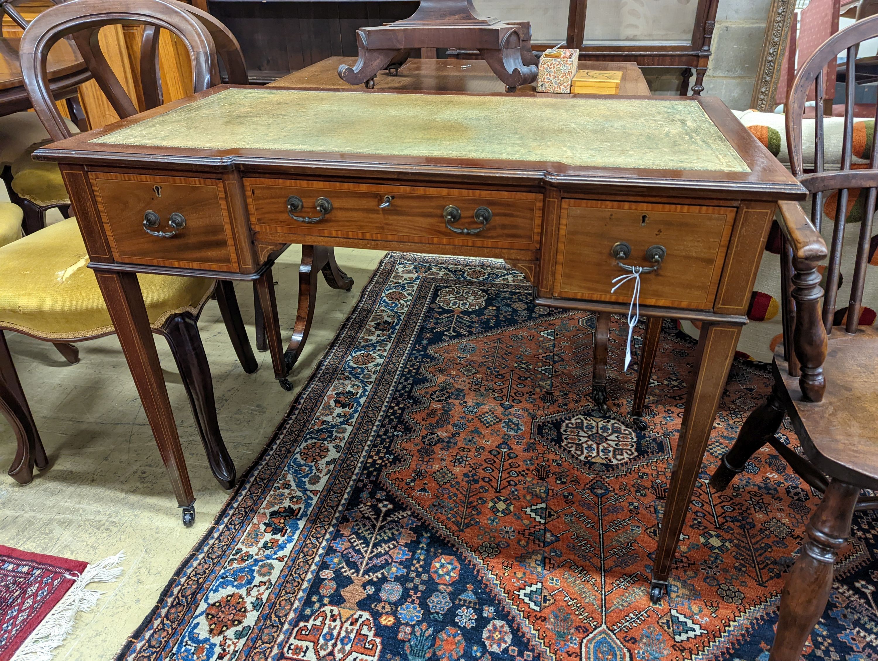 An Edwardian satinwood banded mahogany three drawer writing table, width 99cm, depth 53cm, height 75cm